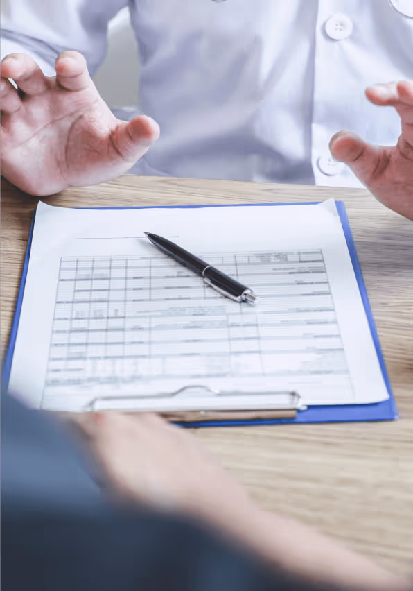 Two people discussing a document